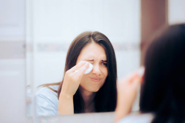 istock Woman Removing her Makeup with Cotton Pads 1389980234
