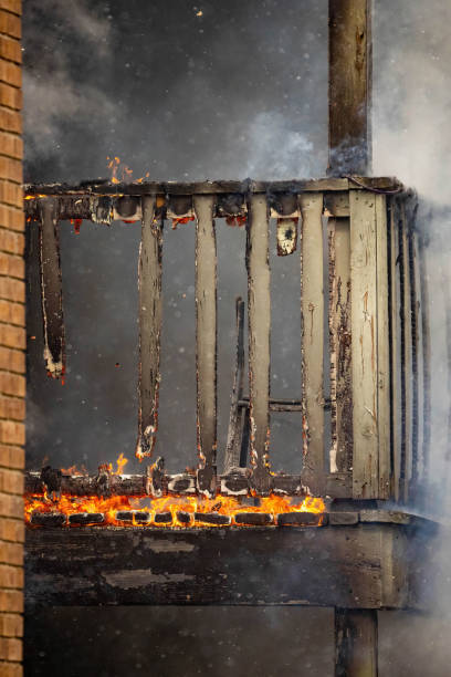 istock Wooden brick house balcony open fire burning disaster 1389989255
