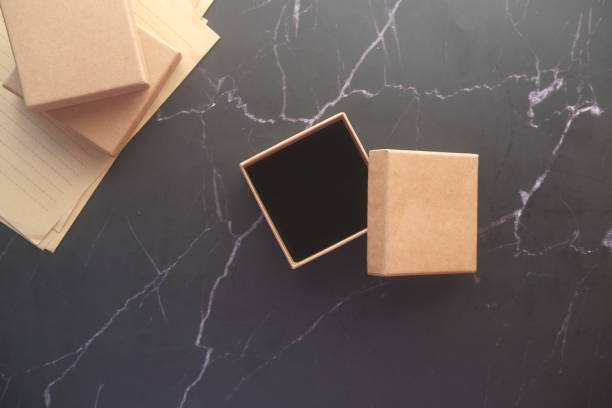 istock top view of person open a empty small gift box 1389990029