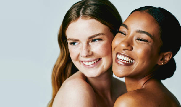 istock Studio shot of two attractive young women posing against grey background 1389993809