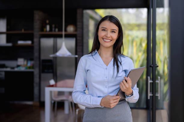 Happy Real Estate Agent selling a beautiful house stock photo