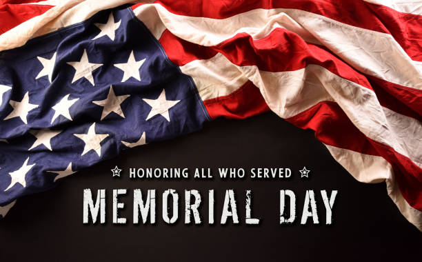 istock Happy memorial day concept made from American flag and the text on dark stone background. 1389994708