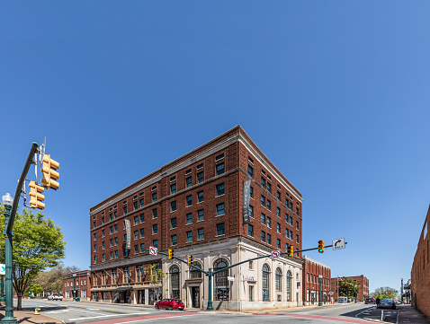 Concord, NC, USA-3 April 2022: The Hotel Concord, completed in 1926, housed the Concord National Bank, now apartments and retail space, and an event venue.