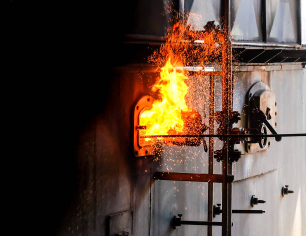 istock Coal in a steam boiler in a factory 1389998005