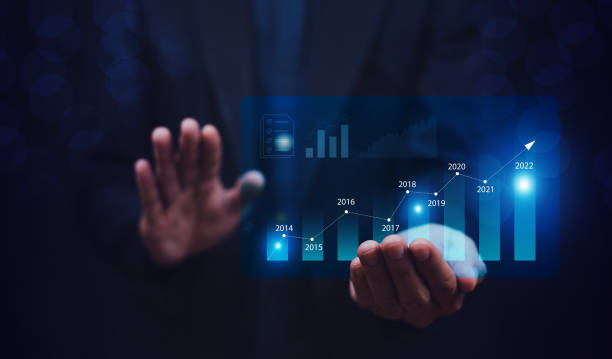 istock Trader holding digital graph on technology visual screen for trading online stock market forex or stock exchange 1390003493