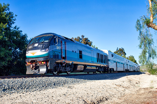 Moorpark, California, USA - April 06, 2022: Outbound Metrolink Ventura Line Commuter approaching Moorpark Station and heading towards East Ventura.