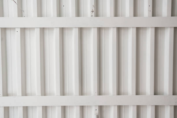 white ceiling with beams and wires. electrics in office premises and warehouses. industrial premises. surface. background.