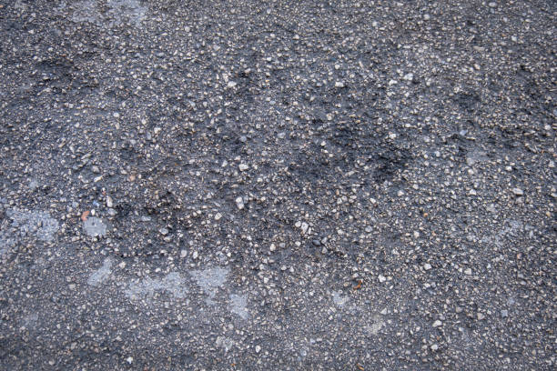istock Gravel and asphalt textured background 1390013919