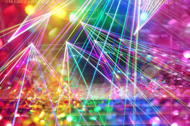 Defocus blurred image abstract dark background of light with stripes of colorful rays of performance party. Defocus blurred image abstract dark background of light with stripes of colorful rays of performance party. heptathlon stock pictures, royalty-free photos & images