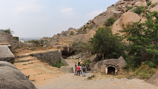India, Karnataka, February 2022, Tourist at Onake Obavvuna Kindi And Anjaneya Swami Temple Boulders, Elesuttina Kote or Chitradurga fort