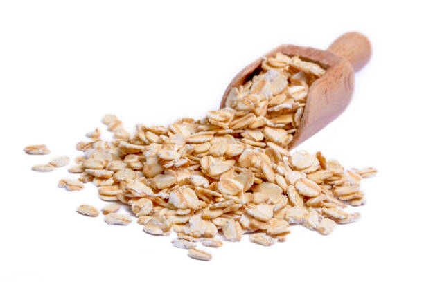 istock Heap of dry rolled oats isolated 1390017367