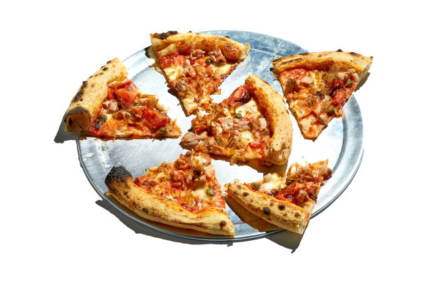 istock Sliced Pizza with tomatoes, chicken and white sauce isolated on white background 1390017374