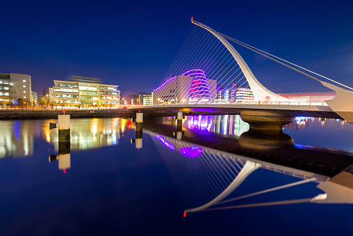 Dublin, Ireland - Wide angle view of the Samuel Beckett Bridge over the River Liffey at dusk. Designed by Santiago Calatrava and opened in 2009.