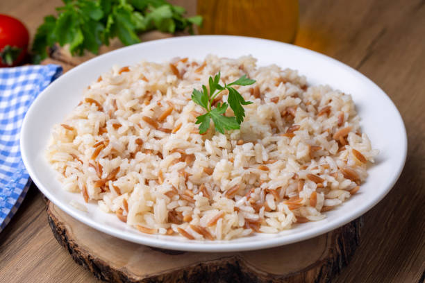 Traditional delicious Turkish food; Turkish style rice pilaf (Turkish name; Arpa sehriyeli pirinc pilavi) Traditional delicious Turkish food; Turkish style rice pilaf (Turkish name; Arpa sehriyeli pirinc pilavi) ARPA stock pictures, royalty-free photos & images