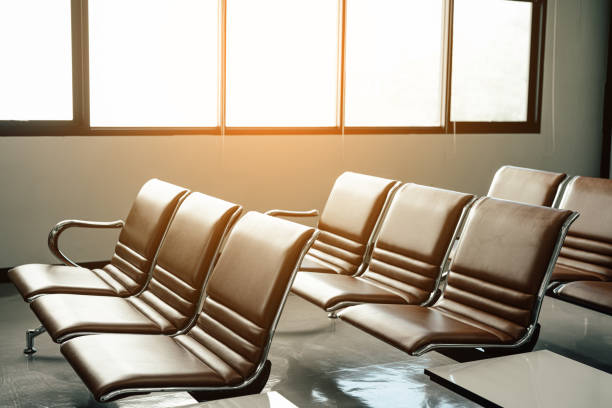 istock Empty chairs in airport terminal. 1390018444