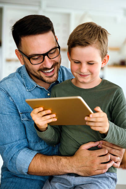 istock Distance learning, online education, home work concept. Family with digital devices at home. 1390019210