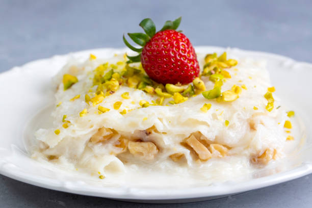 istock Close-up walnut gullac dessert. Traditional Ramadan dessert. Middle Eastern desserts. 1390019238