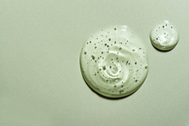 istock Gel drops on green background 1390020309