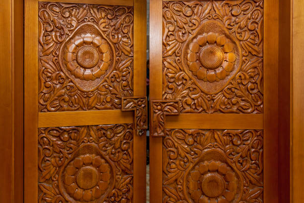 istock Wooden door with carved patterns 1390020355