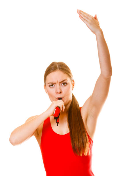 istock Lifeguard on duty whistling. 1390022838