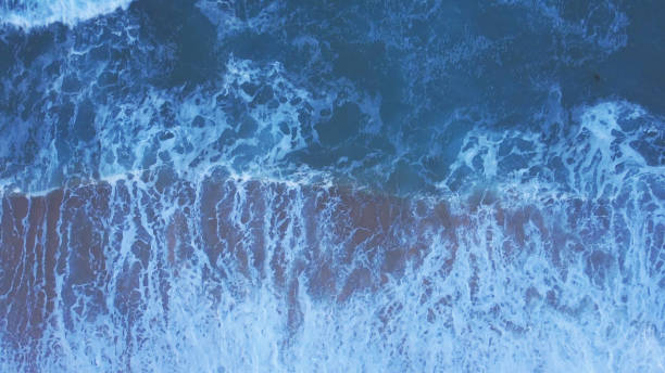 istock Aerial Drone top down view of Sea Waves 1390023396
