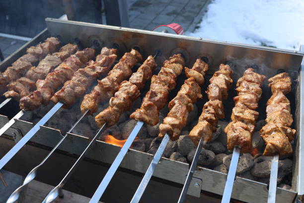 istock Roasted meat cooked at barbecue with smoke 1390026452