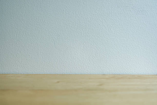istock Wooden floor with white concrete surface background. Blank soft tone background minimal style. 1390027427
