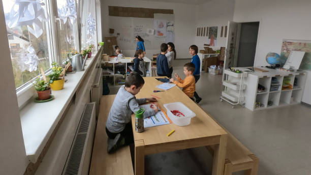 istock Children doing craft in art class 1390027465