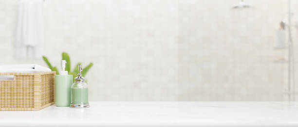 istock White granite bathroom tabletop with mockup space over blurred bright bathroom background. 1390032361