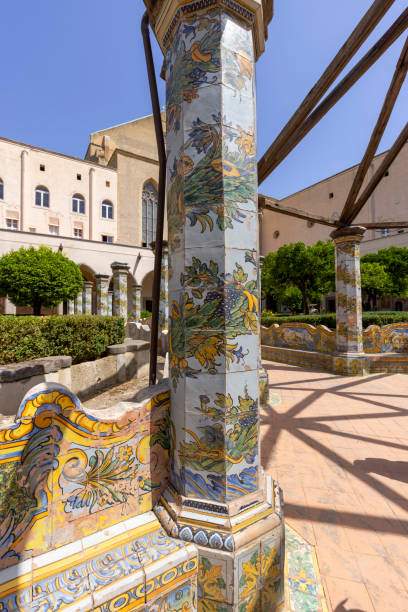 cloister santa chiara with octagonal columns decorated with majolica tiles in rococo style, naples, italy - santa chiara imagens e fotografias de stock