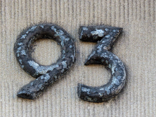 Metal home number on a wall