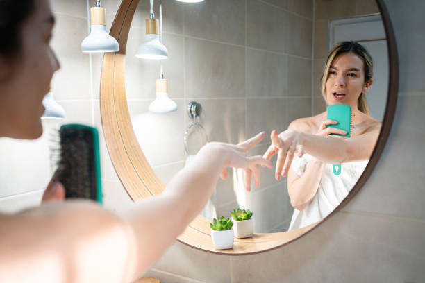 istock Woman singing and dancing, in the bathroom during her morning routine 1390034011