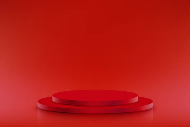istock Red podium in the red room Studio room with red podium for presentations. 1390034733