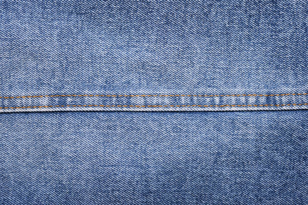 istock Blue jeans background and texture close up.Denim seam. 1390037808