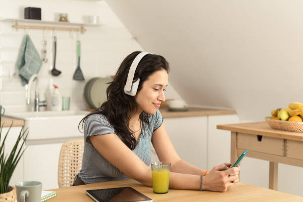istock Girl enjoying music after studying 1390039868