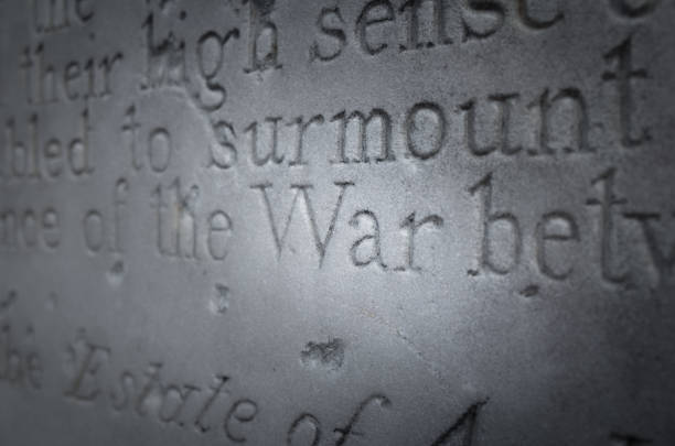 The word 'War' highlighted in text inscribed on stone memorial.