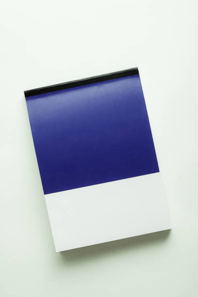 istock Blue and white notebook with blank cover. Blue white notebook on white background. 1390040270