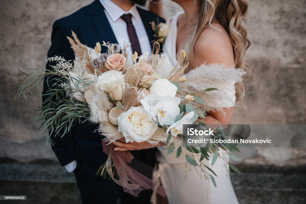 Just married. This day is the first of many beautiful days together. Wedding Stock Photo