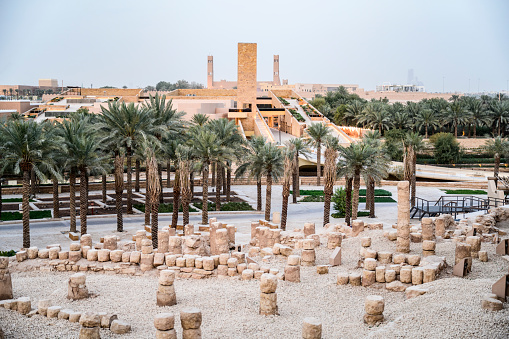 Elevated view of At-Turaif ruins, restored buildings, and desert oasis in UNESCO World Heritage Site near Riyadh. Property release attached.