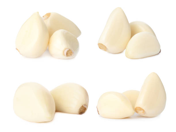 istock Set of fresh garlic cloves on white background 1390041388