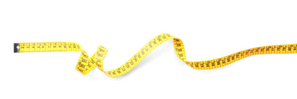istock Long yellow measuring tape isolated on white, top view 1390041545
