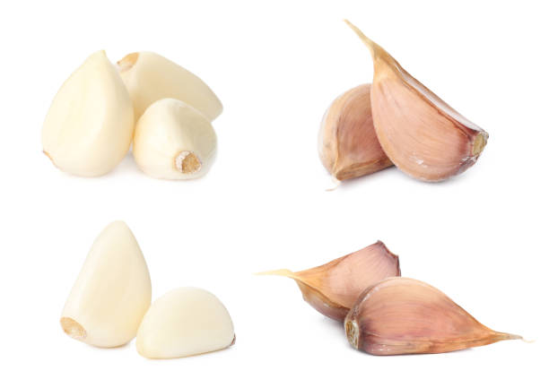 istock Set of fresh garlic cloves on white background 1390041552