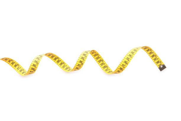 istock Long yellow measuring tape isolated on white, top view 1390041566
