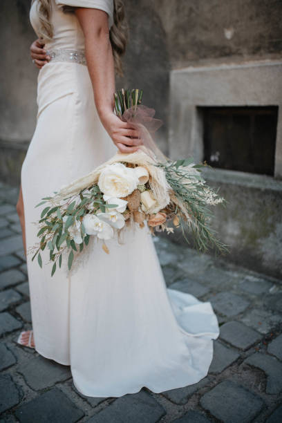 istock Bride holds beautiful wedding bouquet. Rustic wedding bouqet. 1390041747