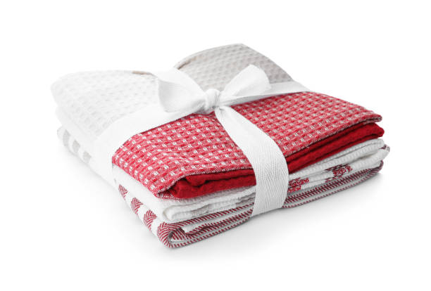 istock Stack of clean kitchen towels isolated on white 1390042760