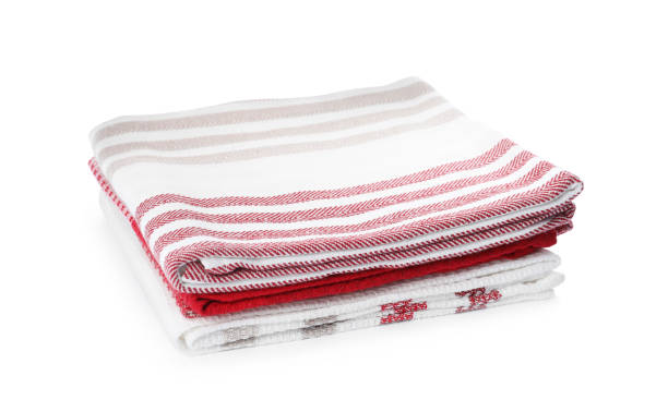 istock Stack of clean kitchen towels isolated on white 1390043077