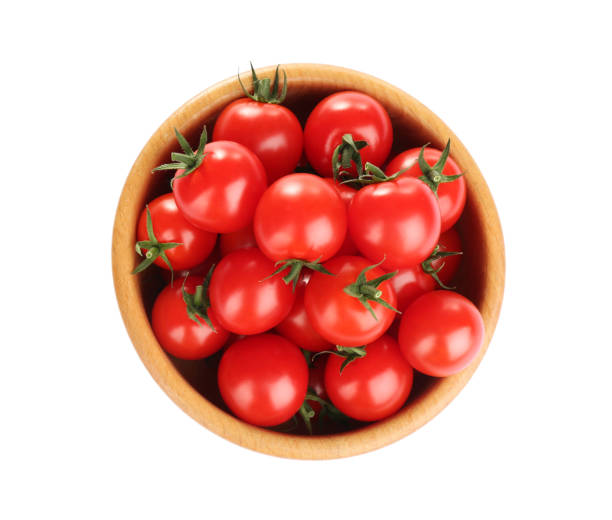 istock Fresh ripe cherry tomatoes in bowl on white background, top view 1390044736