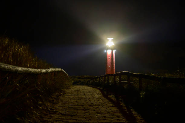 istock Texel lighthouse in the dunes during a stormy autumn night 1390044774