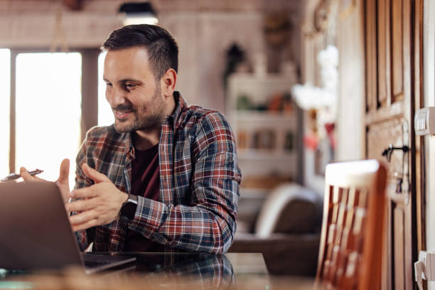 istock Focused man having an online meeting, talking to his clients. 1390044776