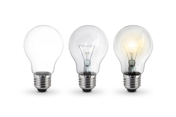 lighted bulb isolated on white background lighted bulb isolated on white background light bulb filament photos stock pictures, royalty-free photos & images